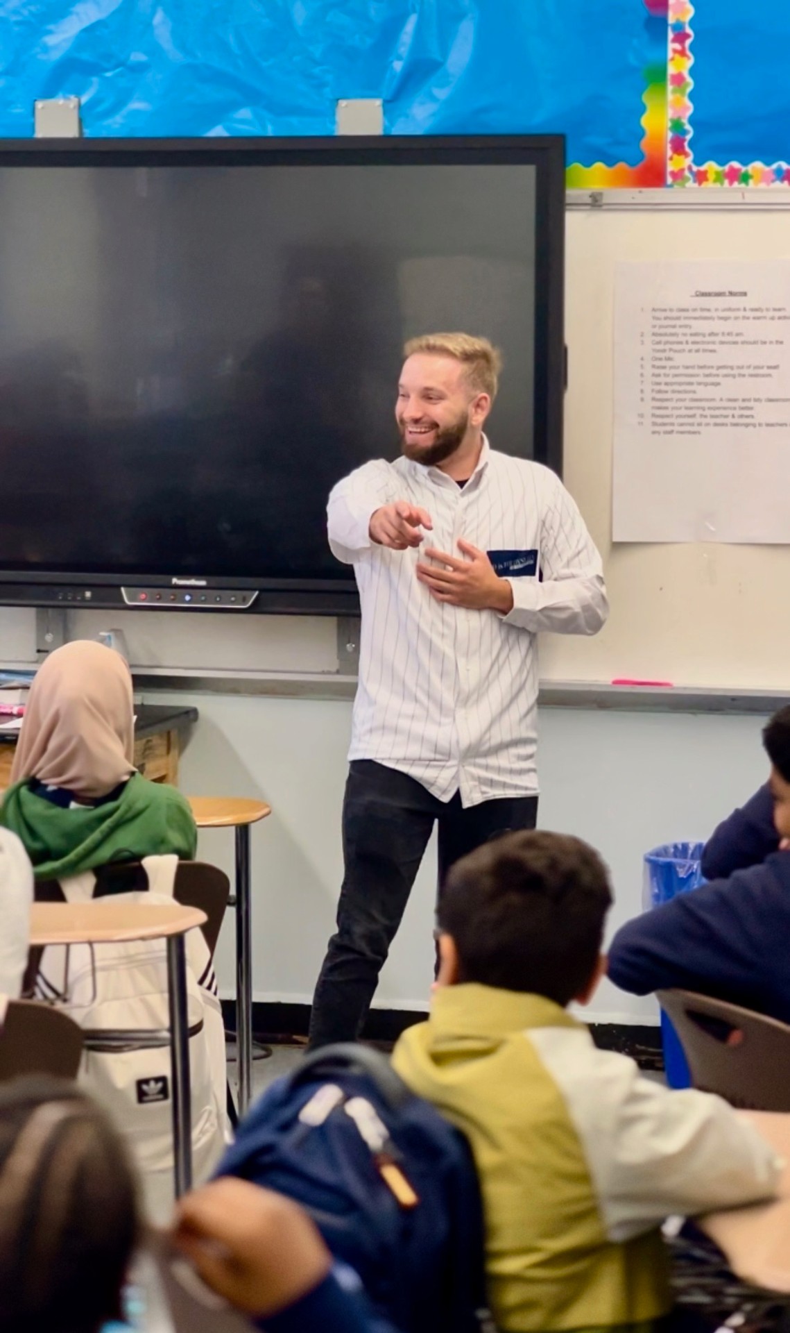 Dylan Smith speaking to students in a classroom
